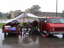 Three karts huddled under a makeshift tent.